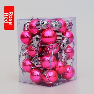 Close-up of 2cm rose red Christmas ball ornaments in clear PVC box with silver hanging strings