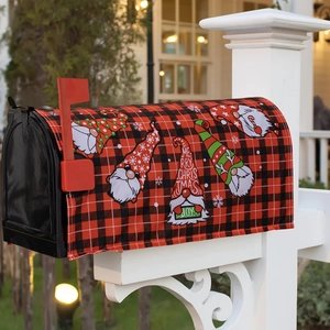 Outdoor Christmas mailbox cover featuring red plaid pattern and festive garden gnomes