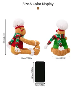 Detailed size chart of knit gingerbread man doll showing dimensions next to a phone