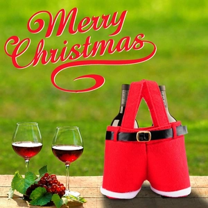 Christmas Santa pants wine bottle gift bag with dual bottle holders on a wooden table