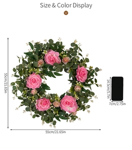 Size display of 21.65 inch pink camellia and eucalyptus wreath with scale reference