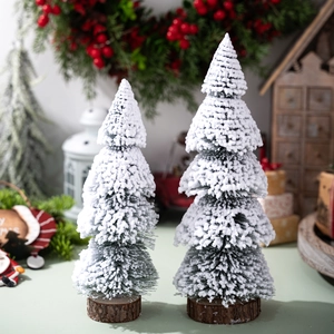 Mini frosted cedar Christmas trees with natural wood base for festive tabletop decor