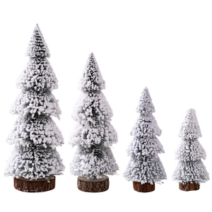 Set of four mini flocked cedar Christmas trees with natural wood bases for table decor