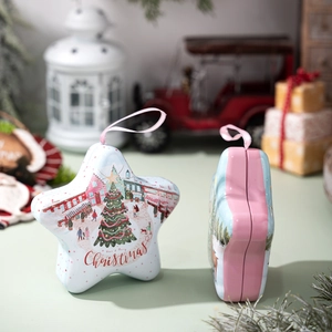 Star-shaped Christmas tin gift box with festive illustration and hanging ribbon loop