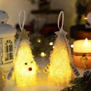 Illuminated plush Christmas tree ornaments with warm LED lights for festive decor