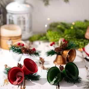 Christmas bell ornaments set with pine needles and pinecones for festive tree decoration