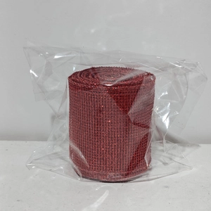 Detail of red glitter mesh ribbon roll for Christmas DIY gift box bow decorations