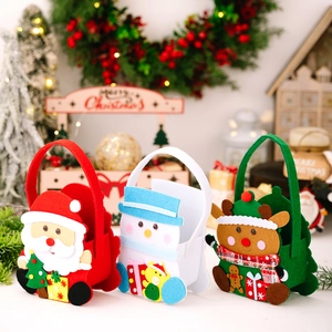 Three Christmas felt gift bags featuring Santa, Snowman, and Reindeer with festive 3D details