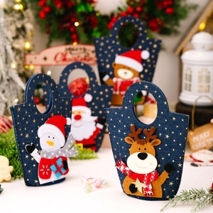 Set of four blue Christmas gift bags with Santa and Snowman cartoons for holiday candy