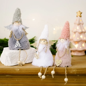 Three plush Christmas angel dolls with sequin wings and wooden beads on wooden surface