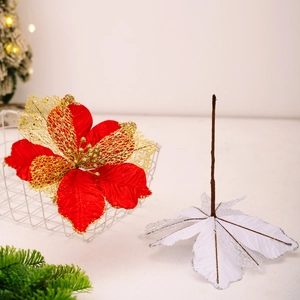 Artificial red velvet and gold mesh Christmas flower decoration in a white basket