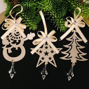 Three-piece golden metal Christmas ornaments with snowman, star and tree designs