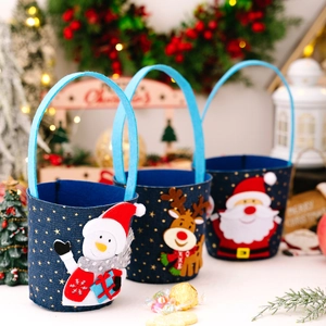 Three Christmas denim gift bags featuring snowman, elk, and Santa with gold stars