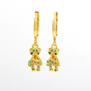 Detailed close-up of gold plated huggie earrings with rainbow zircon teddy bear charms