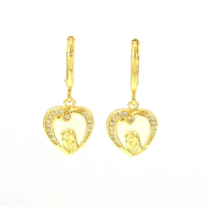 Detail view of heart-shaped gold hoop earrings featuring religious portrait and zircon