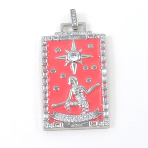 Detailed macro view of S925 sterling silver tarot pendant with red enamel and star emblem