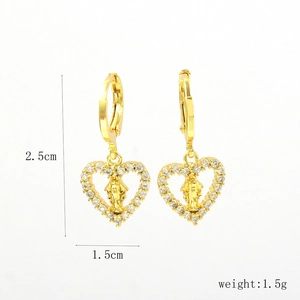 Detail view of 18k gold heart earrings with zircon micro-pave and Virgin Mary relief