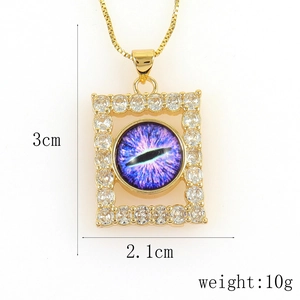 Detail view of gold rectangular evil eye pendant with dimensions 3cm by 2.1cm