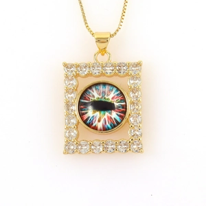 Macro shot of 18k gold plated rectangular evil eye pendant necklace with cubic zirconia