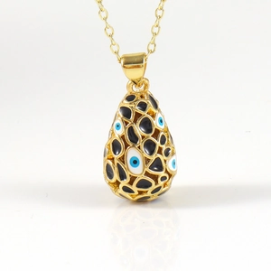 Collier pendentif œuf mauvais œil plaqué or 18K avec design en maille ajourée