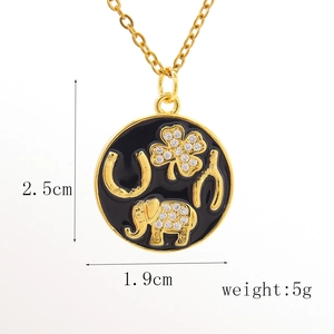 Macro shot of black enamel lucky charm pendant with dimensions 2.5cm by 1.9cm and 5g weight