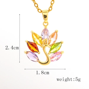 Detailed view of gold peacock pendant with colorful crystals and dimensions 2.4cm by 1.8cm
