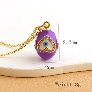 Detail showing purple enamel egg pendant dimensions 2.2x1.2cm with weight of 8g