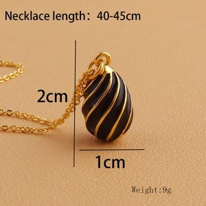 Macro detail of enamel drop pendant with gold spiral lines and size measurements