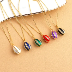 Six colorful enamel egg pendants with cubic zirconia accents on thin gold chains
