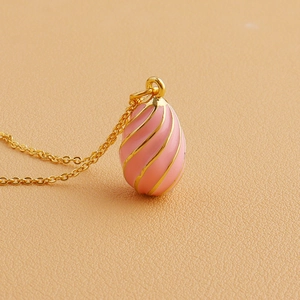 Pink enamel egg pendant necklace with 18k gold spiral accents and fine gold chain