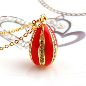Vintage Faberge style red enamel egg pendant necklace with gold metal and tiny rhinestones