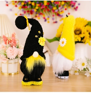 Detail of bee themed gnomes with sunflower accents and textured plush fabric details