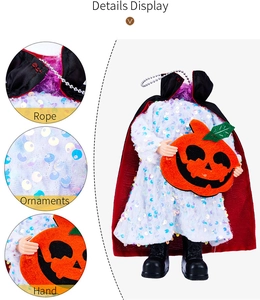 Close-up details of headless demon figure with red cape and pumpkin for Halloween