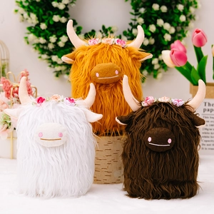 Set of three fluffy plush Scottish Highland cows in white, ginger, and brown with floral crowns