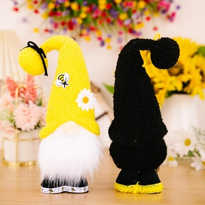 Charming bee-themed gnome plush dolls with yellow knit hats and daisy floral accents