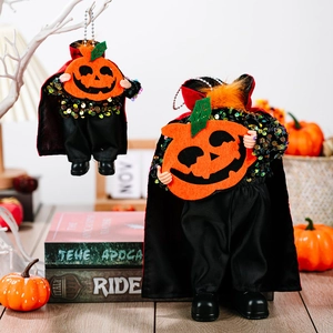 Handmade Halloween pumpkin doll with black sequin cape and orange felt head for decor