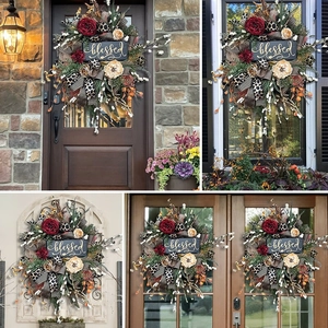 Detailed view of autumn wreath with blessed sign and decorative ribbons on home door