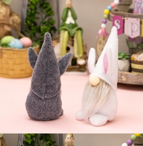 Close-up of Easter gnome dolls with rabbit ears and soft felt texture in a decor tray