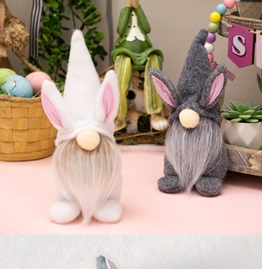 Close-up of Easter rabbit gnomes with white and grey faux fur in a festive home setting