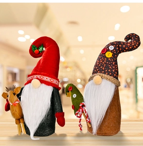 Detail of Christmas gnomes featuring plush red hats and wooden reindeer doll accessories