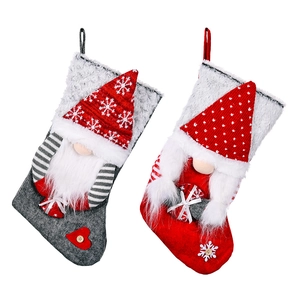 Set of red and grey Christmas stockings with 3D gnomes and snowflake embroidery decoration