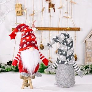 Charming Christmas Gnomes with snowflake knitted hats and stars on a festive snowy backdrop