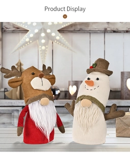 Close-up of Christmas faceless dolls with corduroy texture and reindeer antlers