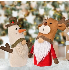 Detail of Christmas faceless gnome dolls with reindeer antlers and plush textures