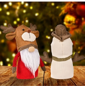 Close-up of festive reindeer gnome wine bottle covers on a rustic wooden table surface