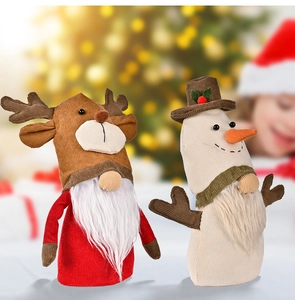 Detail of reindeer and snowman Christmas gnomes with striped fabric and plush textures