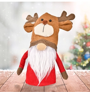 Detail of Christmas reindeer gnome with brown corduroy texture and white faux fur beard