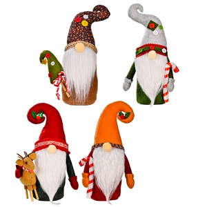 Set of four festive Christmas gnomes in red, green and brown for holiday home decoration