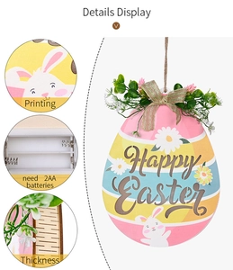 Detail of wooden Easter egg sign showing the battery compartment and Happy Easter print