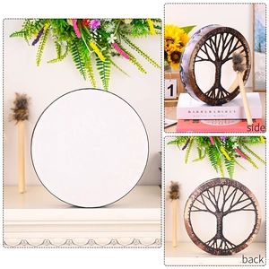 Detailed view of Tree of Life Shaman Drum with white surface and drumstick in home setting